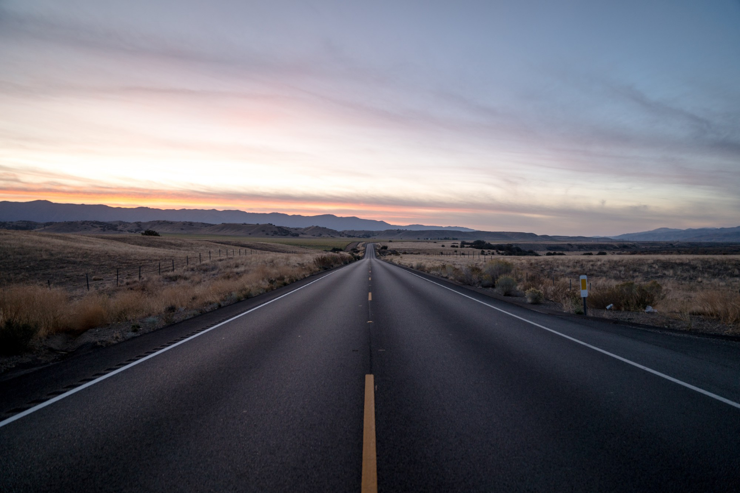 https://logitydispatch.com/wp-content/uploads/2023/10/shot-highway-road-surrounded-by-dried-grass-fields-sky-during-sunset-1.webp
